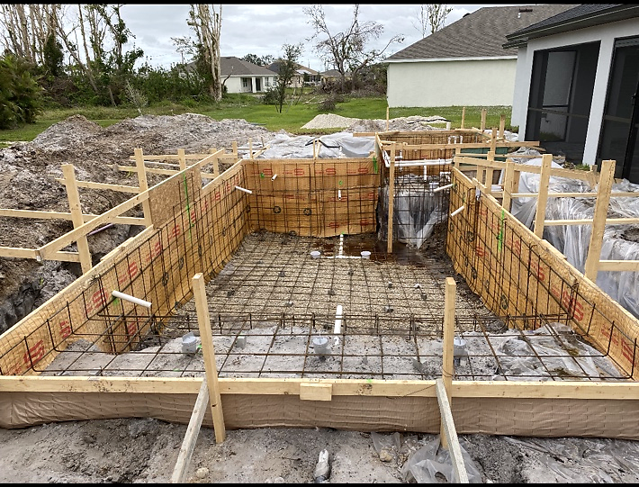 Residential pool shell construction underway